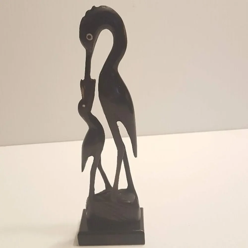 Vintage Stork Bone Figurine feeding a chick. Pre-owned, great shape.